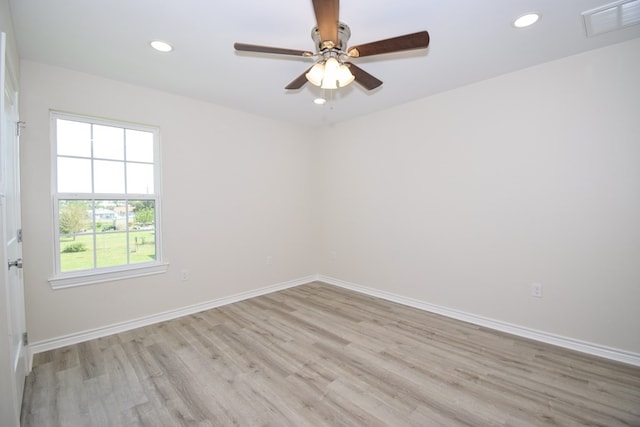 spare room featuring light wood finished floors, baseboards, recessed lighting, and ceiling fan