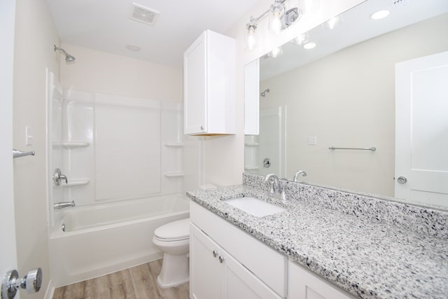 full bath with wood finished floors, toilet, shower / tub combination, and vanity