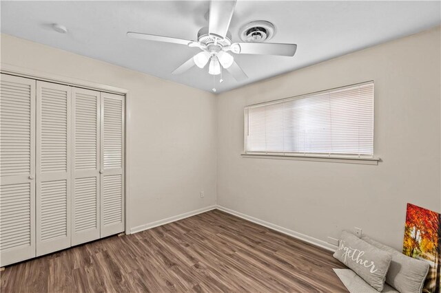 857 Belmeade Dr, Corpus Christi, TX 78412 - unfurnished bedroom featuring a closet, wood finished floors, ceiling fan, and baseboards