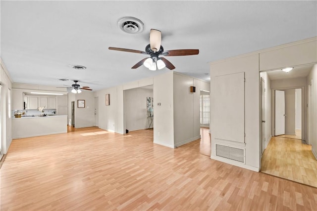 857 Belmeade Dr, Corpus Christi, TX 78412 - unfurnished living room featuring ceiling fan, light wood-style flooring, baseboards, and ornamental molding