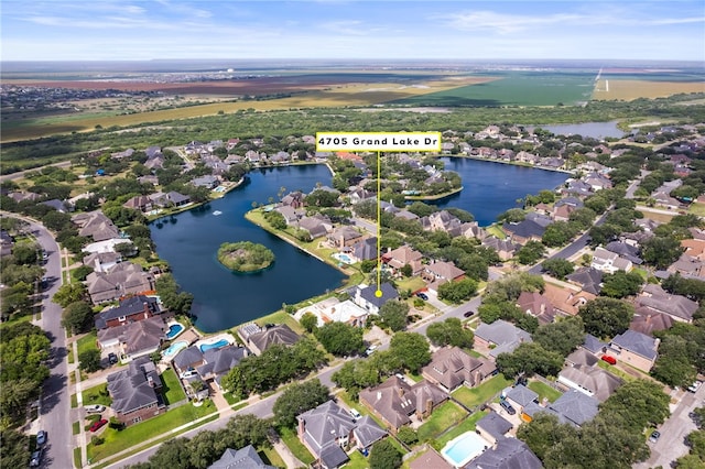 4705 Grand Lake Dr, Corpus Christi, TX 78413 - aerial perspective of suburban area with a nearby body of water