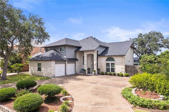 4705 Grand Lake Dr, Corpus Christi, TX 78413 - french country home with roof with shingles, brick siding, and driveway