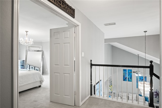 4705 Grand Lake Dr, Corpus Christi, TX 78413 - hall featuring carpet, a chandelier, and an upstairs landing