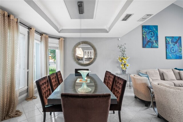 4705 Grand Lake Dr, Corpus Christi, TX 78413 - dining room featuring a raised ceiling and light tile patterned flooring