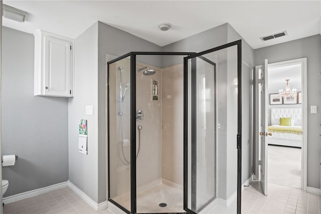 4705 Grand Lake Dr, Corpus Christi, TX 78413 - ensuite bathroom with a shower stall, a chandelier, and tile patterned floors