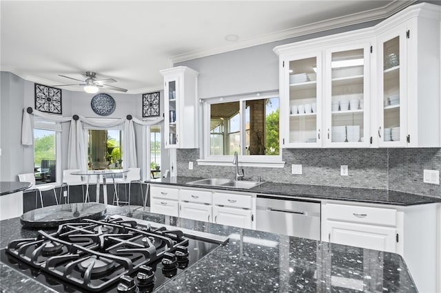 4705 Grand Lake Dr, Corpus Christi, TX 78413 - kitchen featuring stainless steel dishwasher, backsplash, white cabinets, and ornamental molding