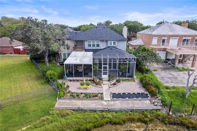 4705 Grand Lake Dr, Corpus Christi, TX 78413 - rear view of house featuring a sunroom, a balcony, a fenced backyard, a chimney, and a shingled roof