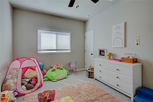 bedroom featuring ceiling fan and light carpet