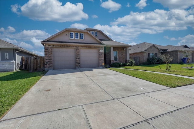 view of front of property featuring a front yard and a garage