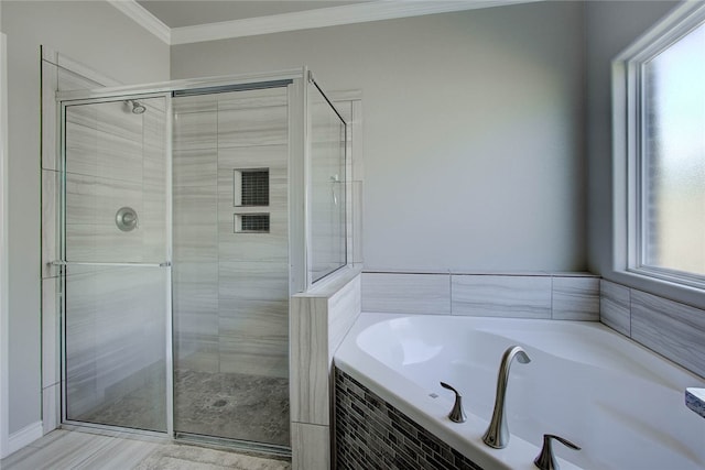 bathroom featuring shower with separate bathtub, crown molding, and plenty of natural light