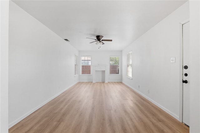 3618 Lawnview St, Corpus Christi, TX 78411 - unfurnished living room with ceiling fan, light wood-type flooring, and baseboards