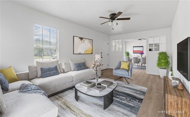 3618 Lawnview St, Corpus Christi, TX 78411 - living room with wood finished floors, a ceiling fan, and baseboards