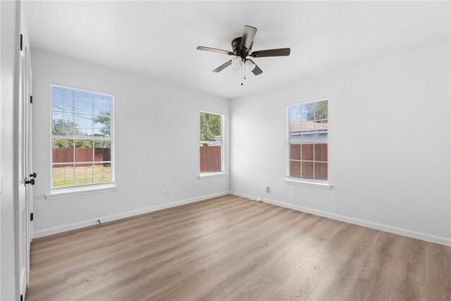 3618 Lawnview St, Corpus Christi, TX 78411 - unfurnished room featuring light wood-type flooring, a ceiling fan, and baseboards