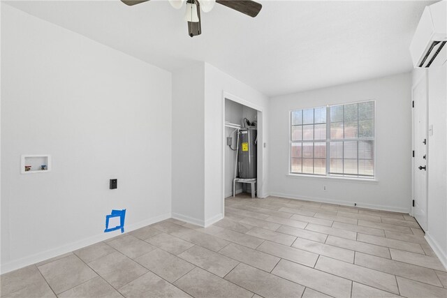 3618 Lawnview St, Corpus Christi, TX 78411 - spare room featuring a wall unit AC, a ceiling fan, and baseboards