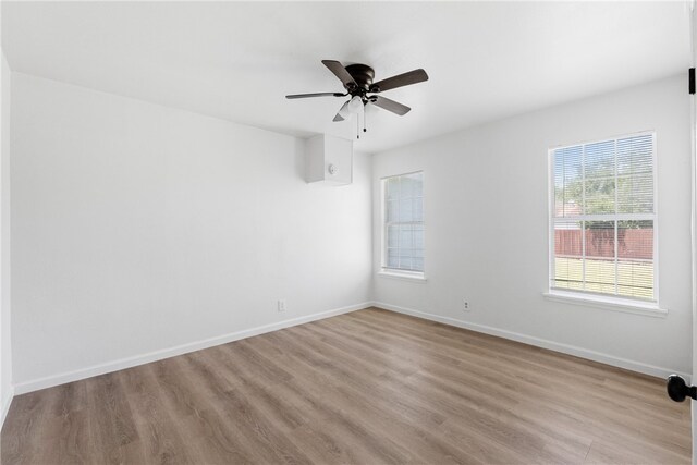 3618 Lawnview St, Corpus Christi, TX 78411 - empty room featuring wood finished floors, baseboards, and a ceiling fan
