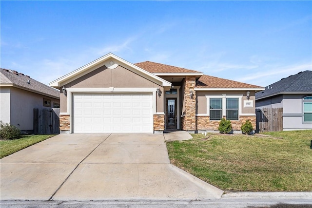 view of front of house featuring a front lawn and a garage