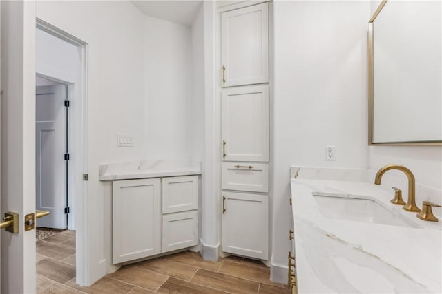 bathroom featuring vanity and wood finish floors