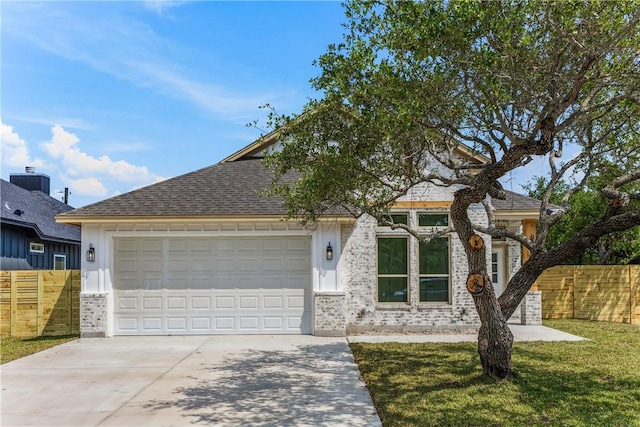 view of front of property with fence, a front lawn, brick siding, a garage, and driveway