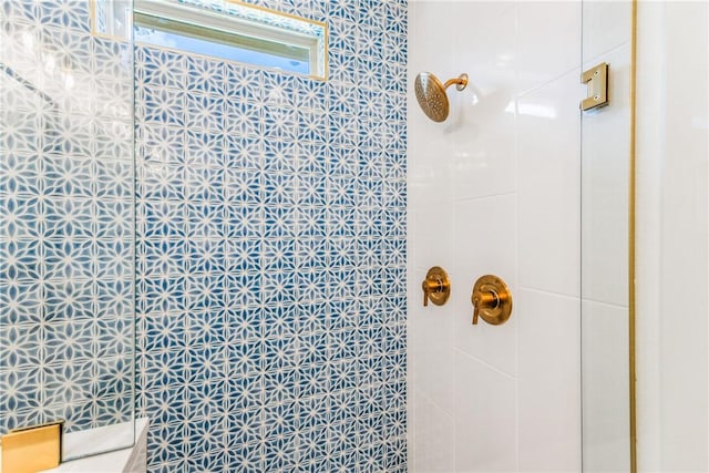 full bath featuring a tile shower