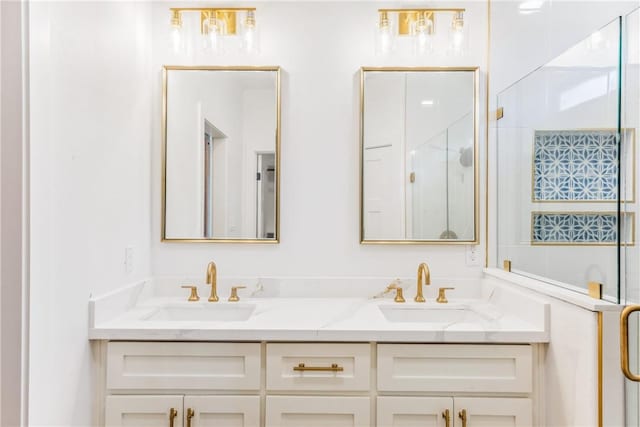 bathroom featuring double vanity, a shower stall, and a sink