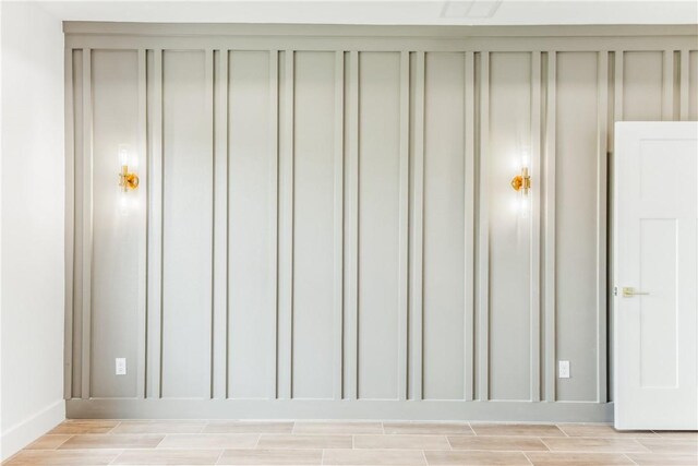 details with baseboards and wood finish floors