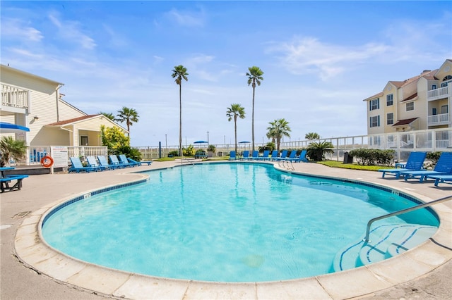 view of swimming pool with a patio area