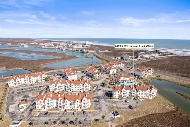 aerial view with a beach view and a water view