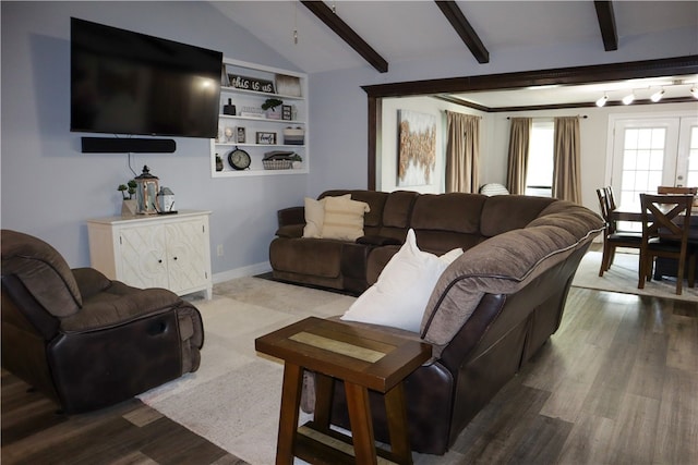 living room featuring lofted ceiling with beams and wood-type flooring