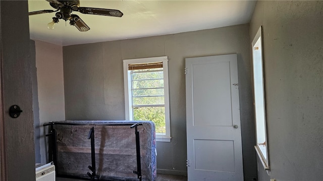 interior space featuring ceiling fan