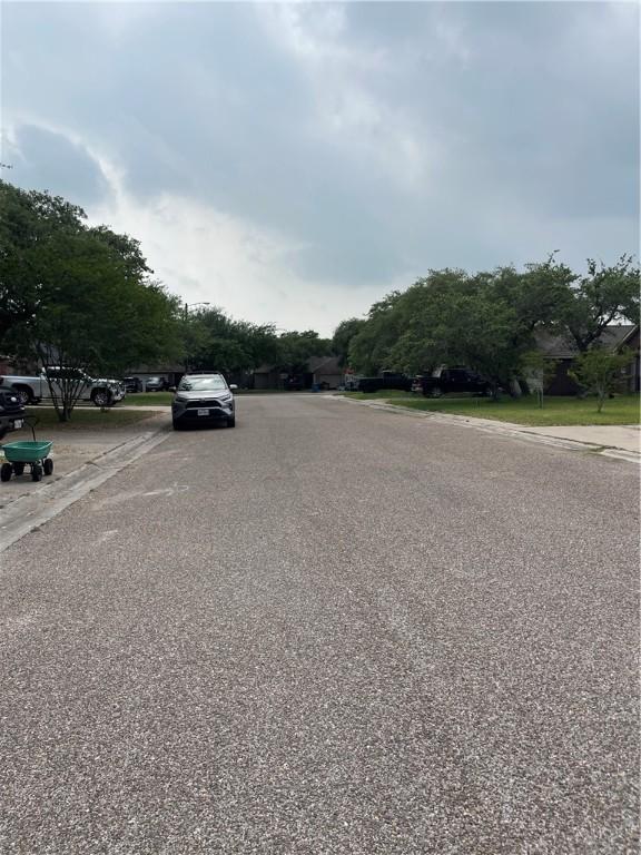 2237 Sunset Cliff Dr, Ingleside, TX 78362 - view of asphalt road featuring curbs and sidewalks