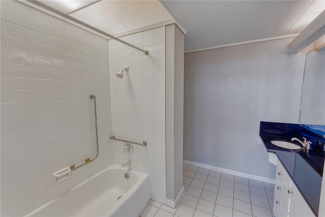 full bath featuring vanity, baseboards, tile patterned flooring, and shower / bath combination