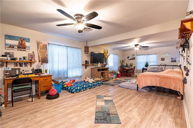 606 N Ironwood Ave, Bishop, TX 78343 - bedroom featuring wood finished floors, an office area, and a ceiling fan