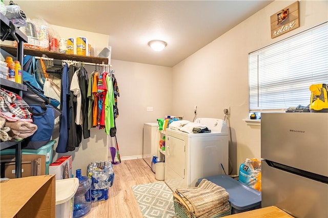 606 N Ironwood Ave, Bishop, TX 78343 - laundry area with separate washer and dryer and wood finished floors