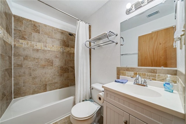 478 S County Road 1144, Riviera, TX 78379 - full bathroom with toilet, shower / bathtub combination with curtain, vanity, and decorative backsplash