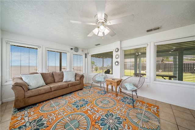 478 S County Road 1144, Riviera, TX 78379 - sunroom with a textured ceiling, tile patterned flooring, and baseboards