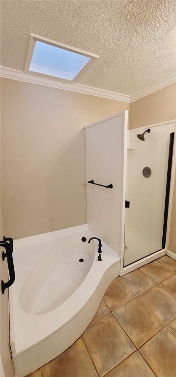 bathroom featuring a textured ceiling, tile patterned floors, and ornamental molding