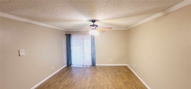 empty room with ceiling fan, wood-type flooring, a textured ceiling, and ornamental molding