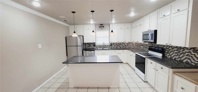 kitchen featuring pendant lighting, a kitchen island, white cabinetry, and appliances with stainless steel finishes