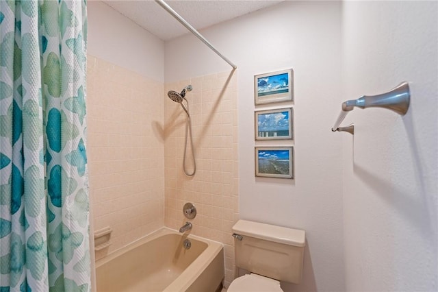 full bathroom featuring a textured ceiling, toilet, and shower / bath combination with curtain
