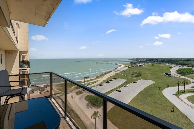 balcony with a beach view and a water view
