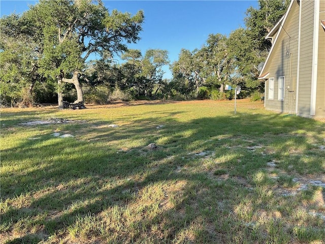 322-342 Whispering Woods Dr, Rockport, TX 78382 - view of green lawn with view of scattered trees