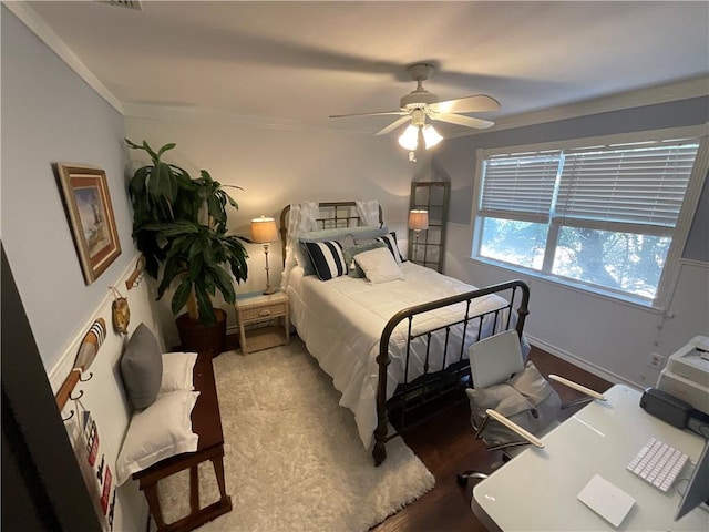 322-342 Whispering Woods Dr, Rockport, TX 78382 - bedroom featuring ceiling fan, crown molding, and wood finished floors