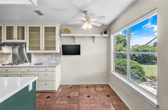 15658 Cumana Dr, Corpus Christi, TX 78418 - kitchen featuring light countertops, a ceiling fan, and tasteful backsplash