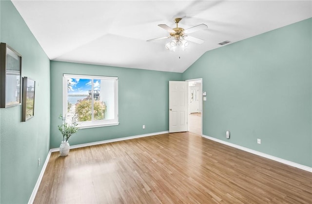 15658 Cumana Dr, Corpus Christi, TX 78418 - spare room featuring lofted ceiling, ceiling fan, and wood finished floors