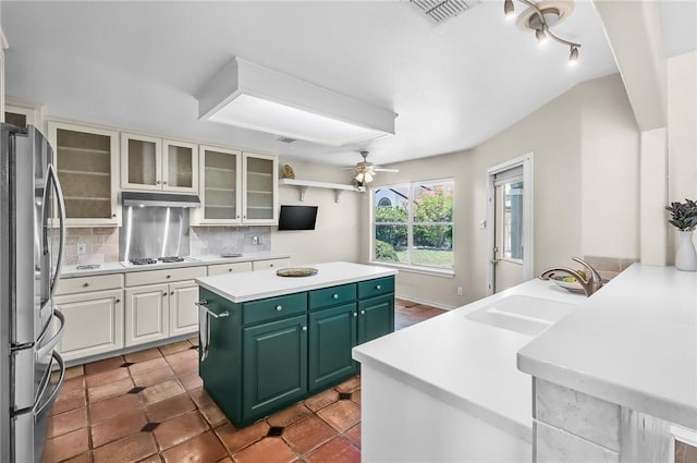 15658 Cumana Dr, Corpus Christi, TX 78418 - kitchen featuring freestanding refrigerator, under cabinet range hood, ceiling fan, a kitchen island, and green cabinetry