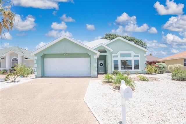 15658 Cumana Dr, Corpus Christi, TX 78418 - single story home with driveway, an attached garage, and stucco siding