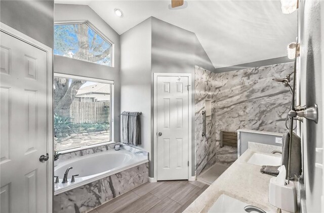 15658 Cumana Dr, Corpus Christi, TX 78418 - full bath featuring vaulted ceiling, a garden tub, and double vanity