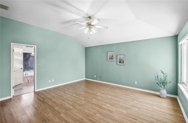 15658 Cumana Dr, Corpus Christi, TX 78418 - spare room featuring lofted ceiling, ceiling fan, and wood finished floors