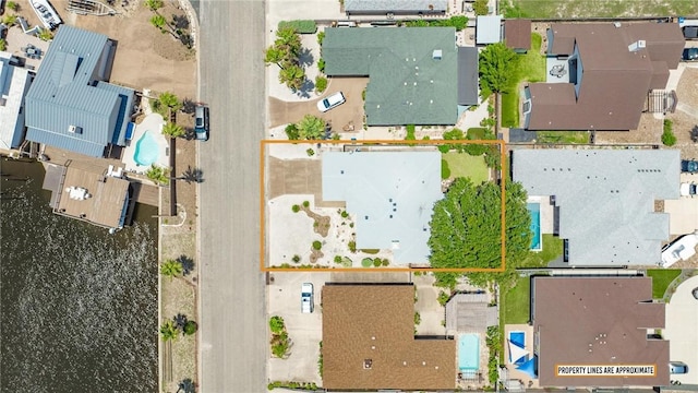 15658 Cumana Dr, Corpus Christi, TX 78418 - aerial perspective of suburban area with a pool and property boundaries highlighted