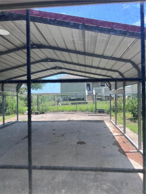 806 Dakota St, Robstown, TX 78380 - view of parking featuring a carport